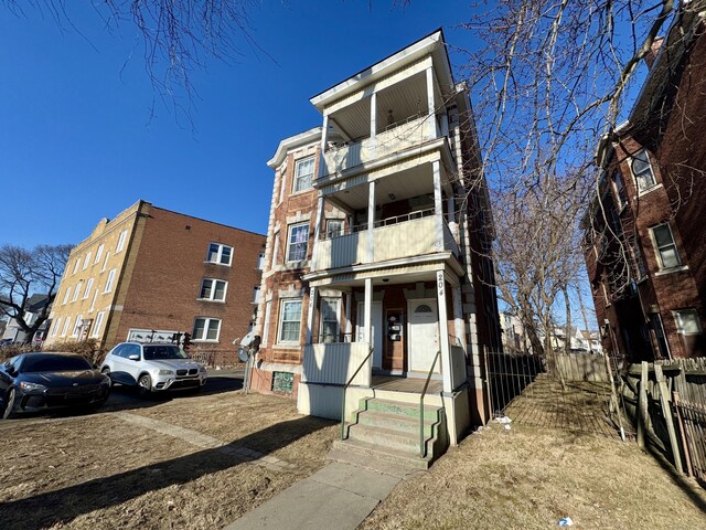 view of front of home with a balcony