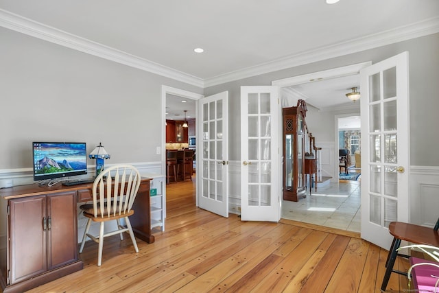 office area featuring recessed lighting, a wainscoted wall, ornamental molding, french doors, and light wood-type flooring