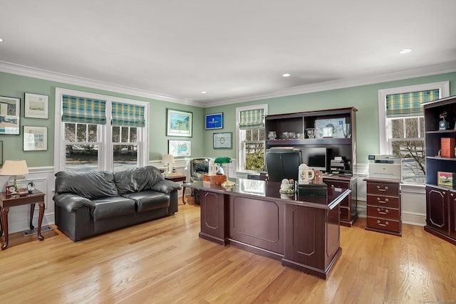 home office with ornamental molding, plenty of natural light, and light wood-style flooring