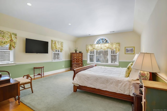 bedroom with recessed lighting, visible vents, vaulted ceiling, and baseboards