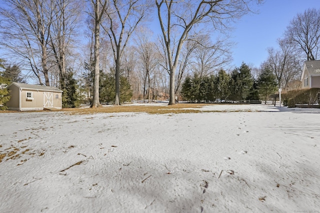 snowy yard with an outdoor structure