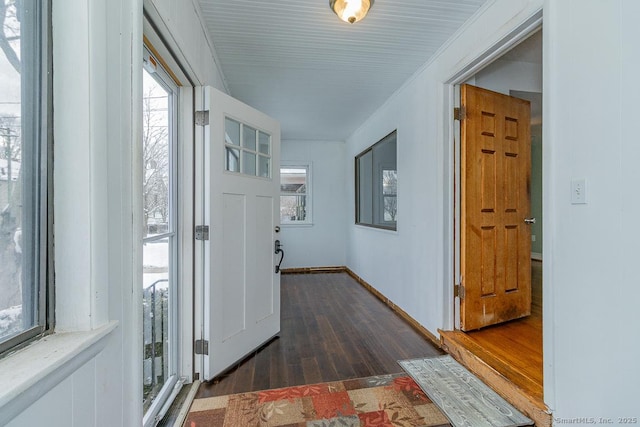 interior space with crown molding and dark hardwood / wood-style flooring