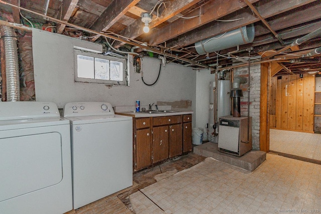 laundry room with cabinets, separate washer and dryer, sink, and water heater