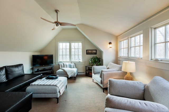 living room featuring baseboard heating, a wealth of natural light, ceiling fan, and lofted ceiling