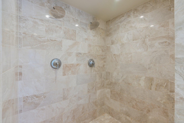 bathroom with a tile shower