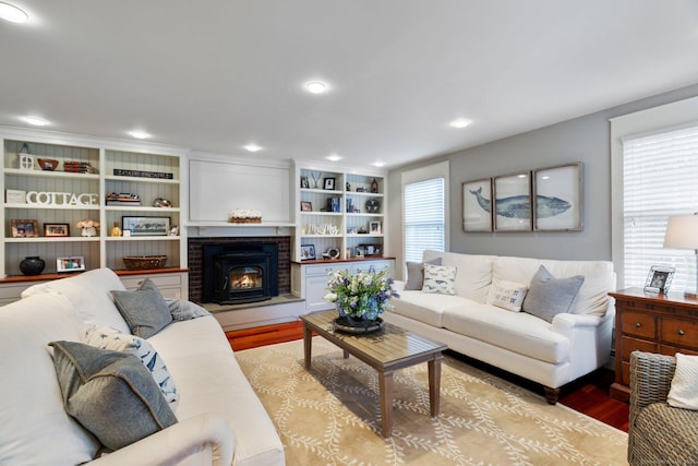 living room with plenty of natural light and light hardwood / wood-style floors