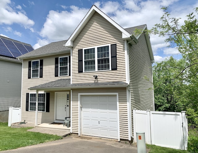 view of front of property featuring a garage