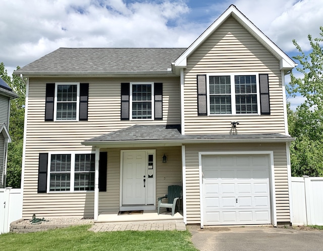 view of front of property featuring a garage