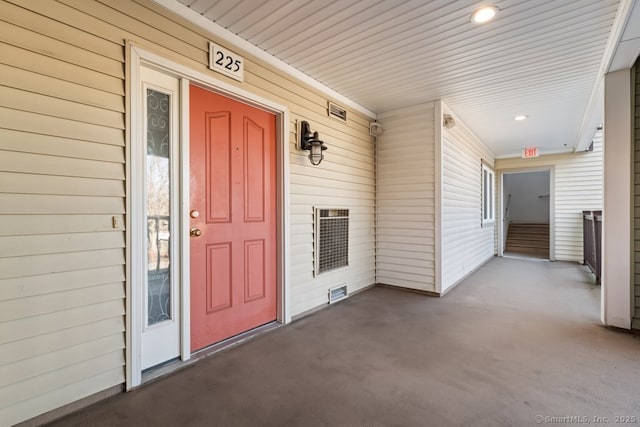 view of exterior entry with covered porch