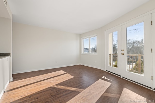 interior space with dark hardwood / wood-style flooring and french doors