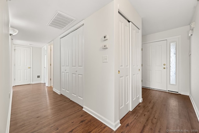 hallway featuring dark wood-type flooring