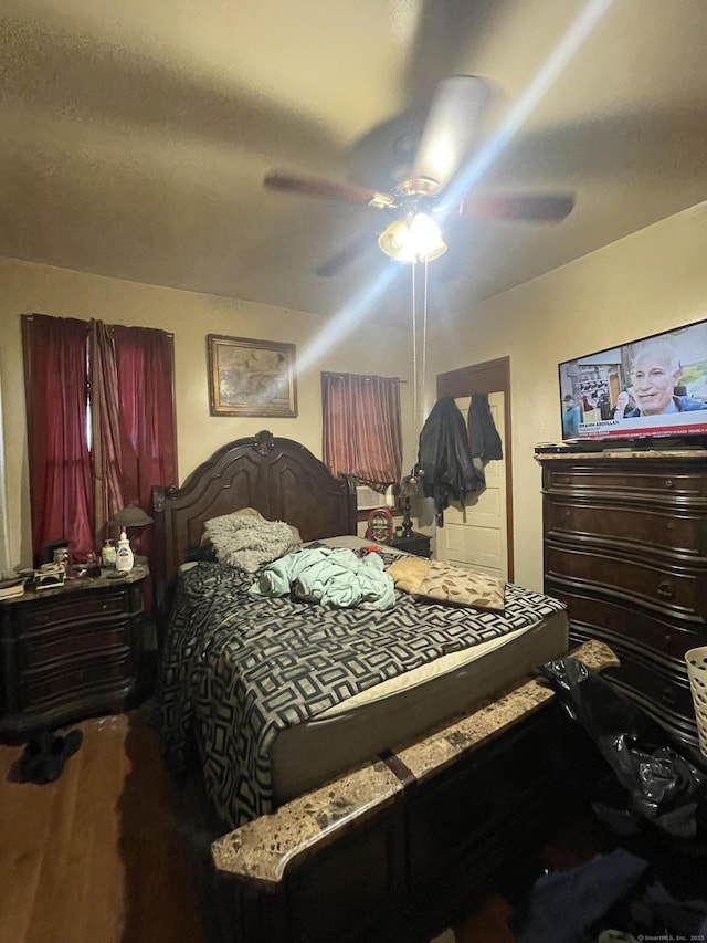 bedroom featuring ceiling fan and wood-type flooring