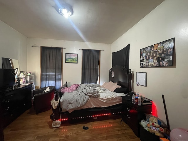 bedroom with hardwood / wood-style floors