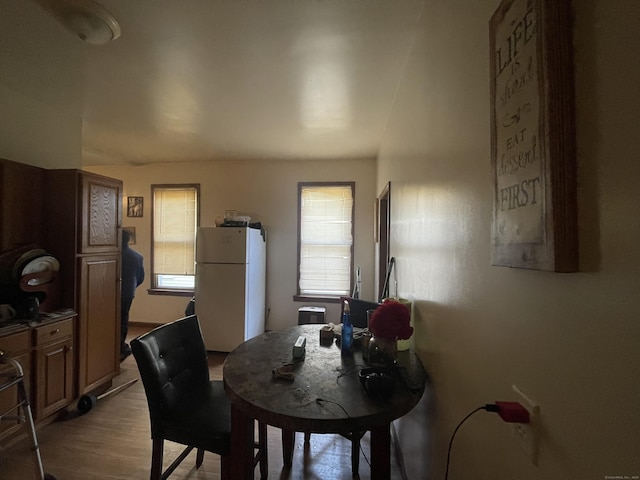 dining area with hardwood / wood-style floors