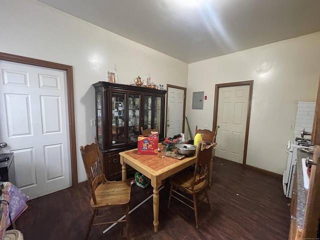 dining space featuring dark hardwood / wood-style flooring and electric panel