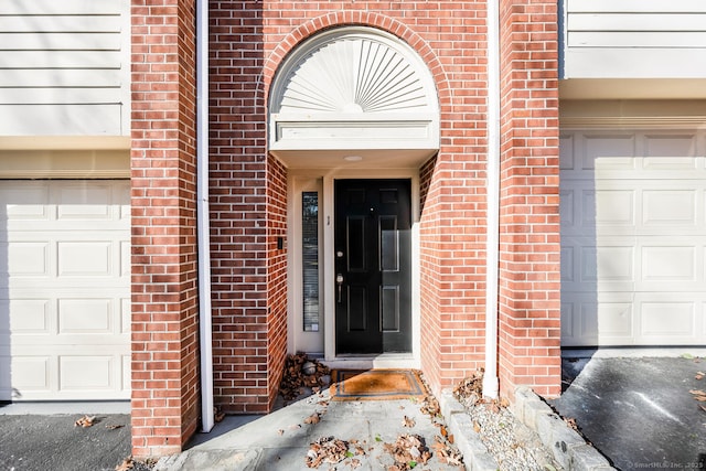 doorway to property featuring a garage