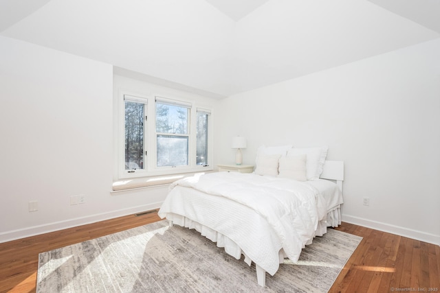 bedroom with hardwood / wood-style flooring