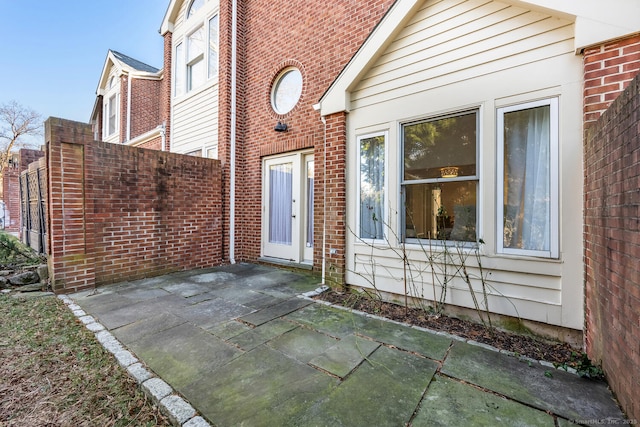 property entrance featuring a patio