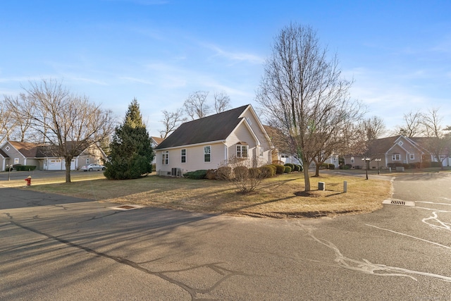 view of side of property featuring a yard