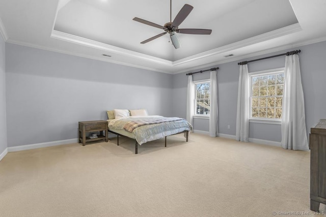 carpeted bedroom featuring ornamental molding, a raised ceiling, and ceiling fan