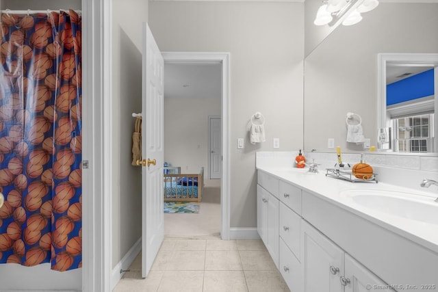 bathroom with tile patterned flooring and vanity