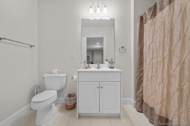 bathroom featuring tile patterned flooring, vanity, curtained shower, and toilet