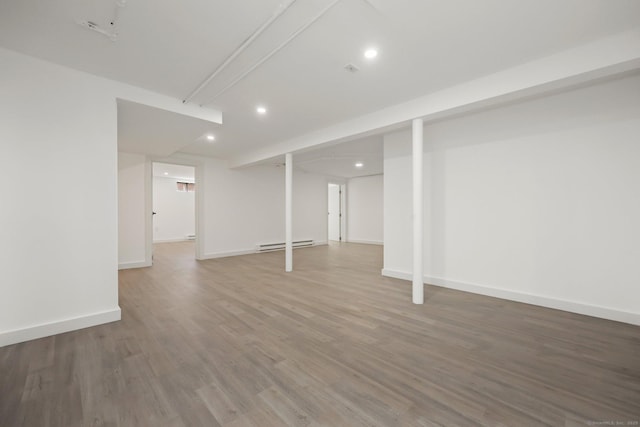 basement with baseboard heating and wood-type flooring