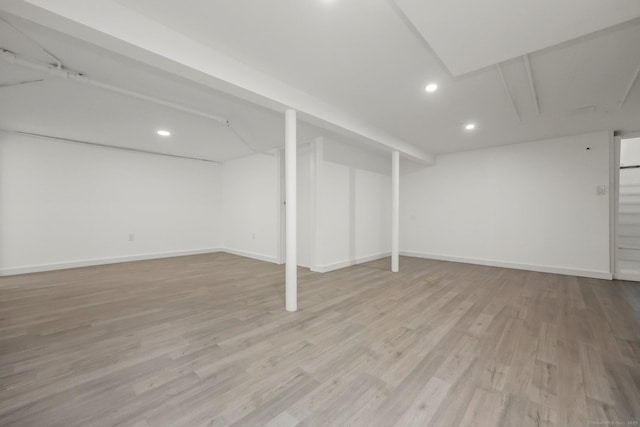 basement featuring light hardwood / wood-style floors