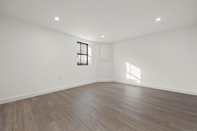 empty room featuring hardwood / wood-style flooring