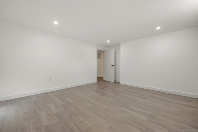 spare room featuring light hardwood / wood-style floors