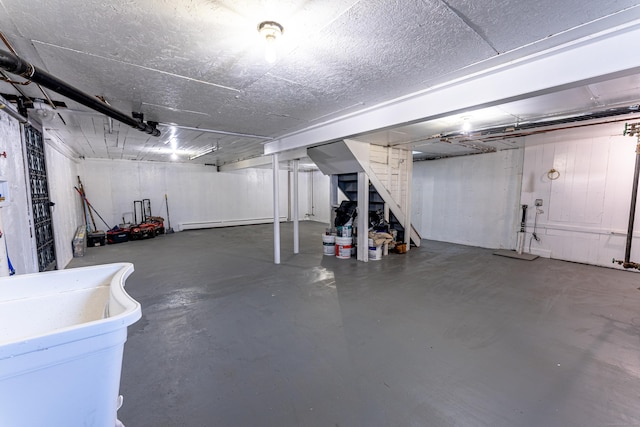 basement featuring a baseboard radiator