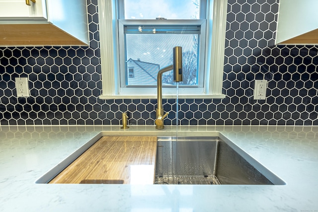 kitchen with decorative backsplash and sink