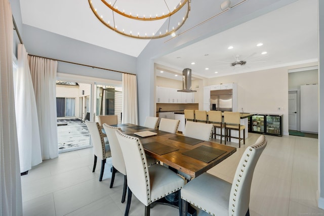 dining room with ceiling fan with notable chandelier