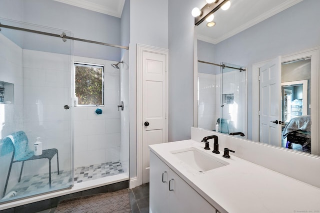 bathroom with tile patterned floors, vanity, ornamental molding, and walk in shower