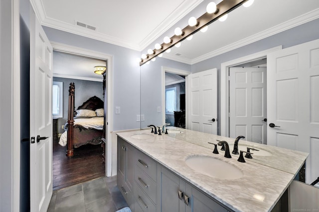 bathroom featuring tile patterned flooring, vanity, and crown molding