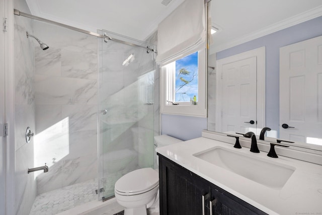 bathroom with ornamental molding, vanity, a shower with shower door, and toilet