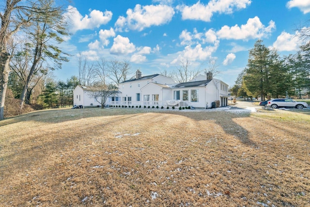 ranch-style home featuring a front yard and a garage