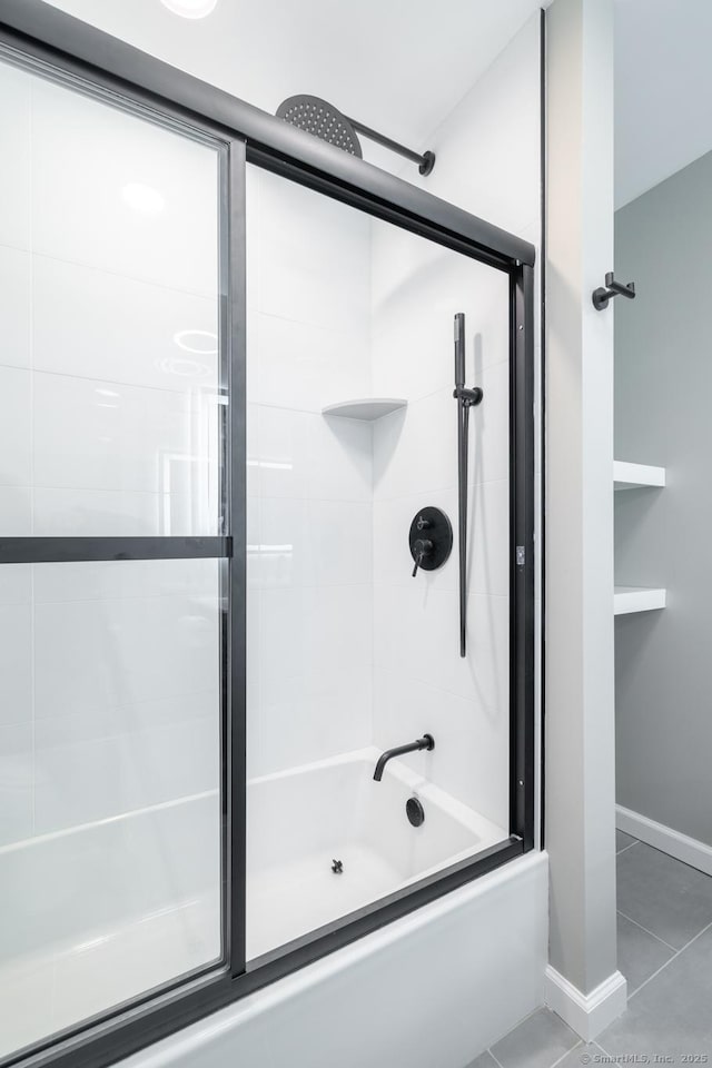 bathroom featuring enclosed tub / shower combo and tile patterned flooring