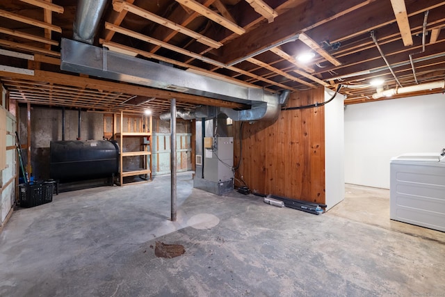 basement with heating unit and washer / dryer