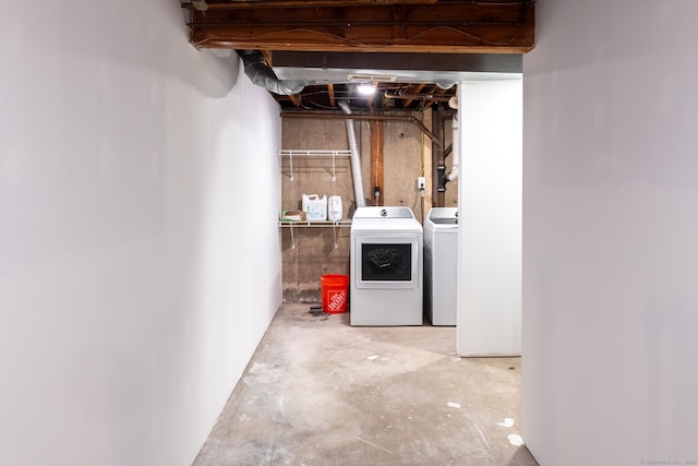 basement featuring washing machine and clothes dryer