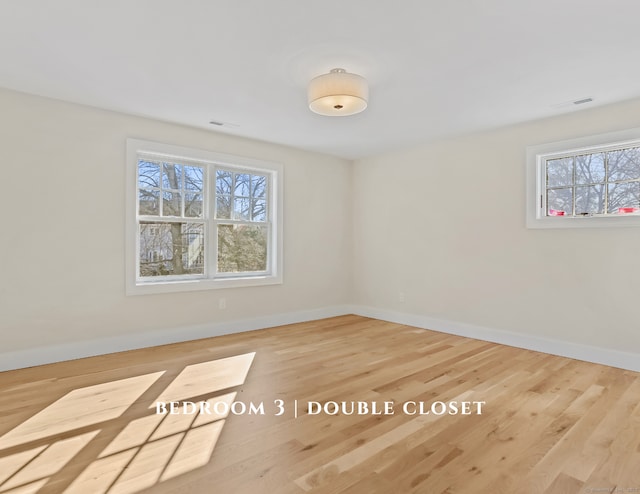 empty room with wood-type flooring