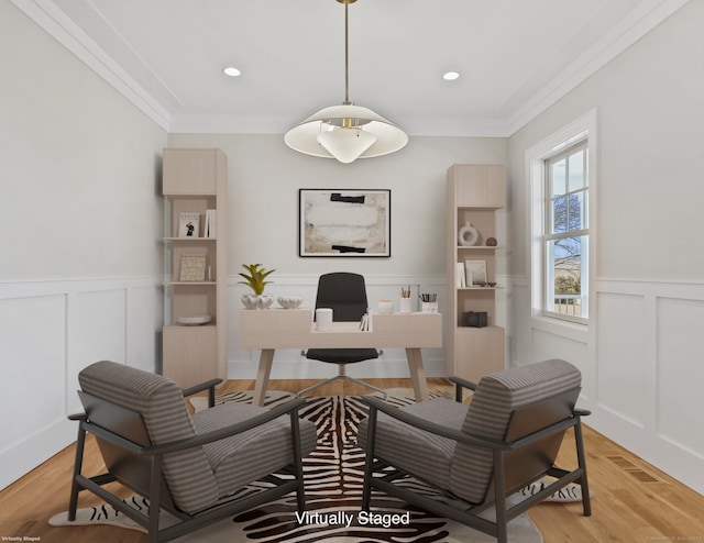 home office featuring ornamental molding and light wood-type flooring