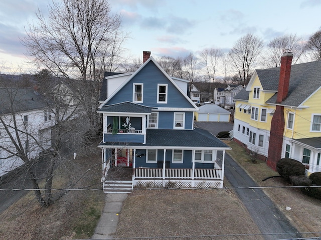 view of front of property with a balcony and a porch