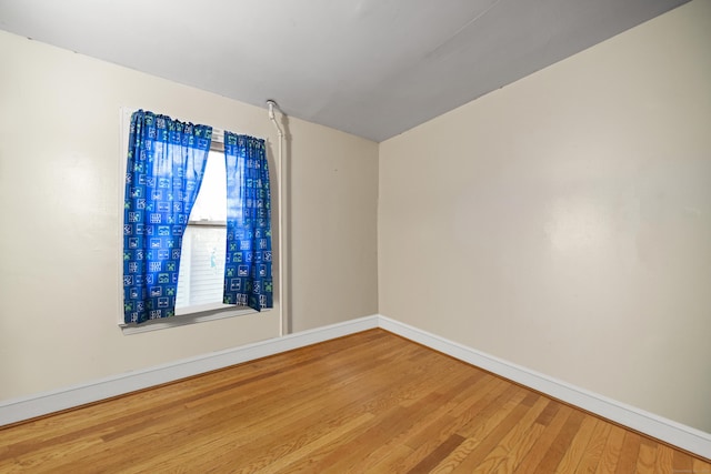 empty room with wood-type flooring