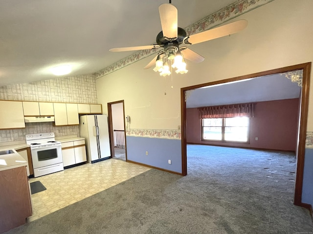 kitchen featuring ceiling fan, tasteful backsplash, light colored carpet, lofted ceiling, and white appliances