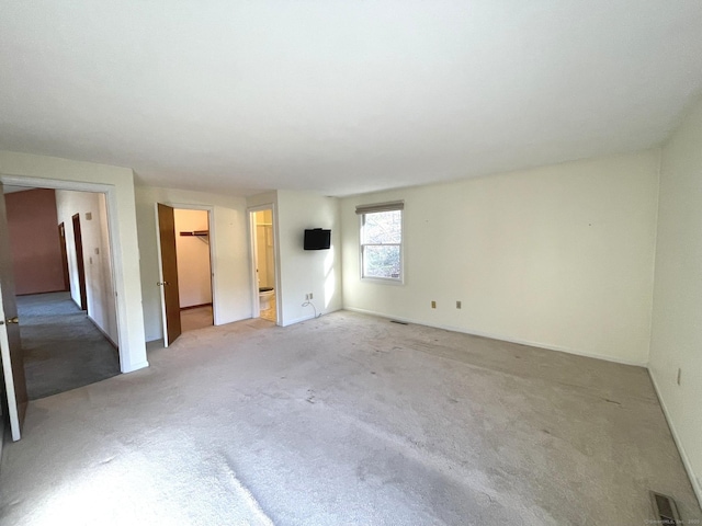 empty room featuring light carpet