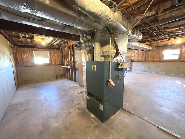 utility room featuring heating unit