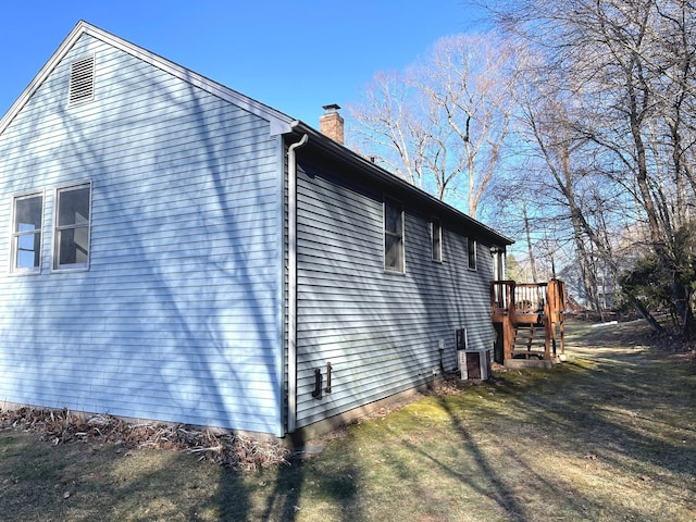 view of property exterior featuring a yard and cooling unit