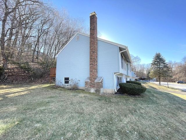 view of home's exterior featuring a lawn