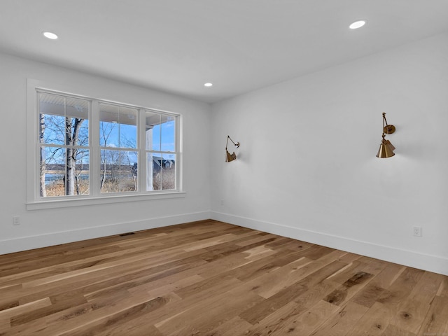 unfurnished room featuring hardwood / wood-style floors